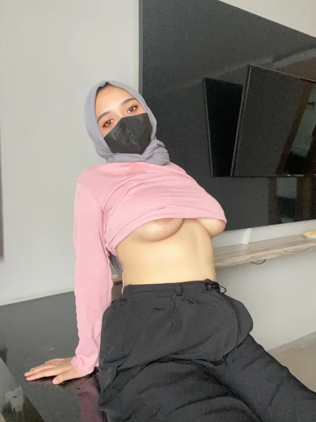 Hijabi MILF in sheer lingerie teases with forbidden curves
